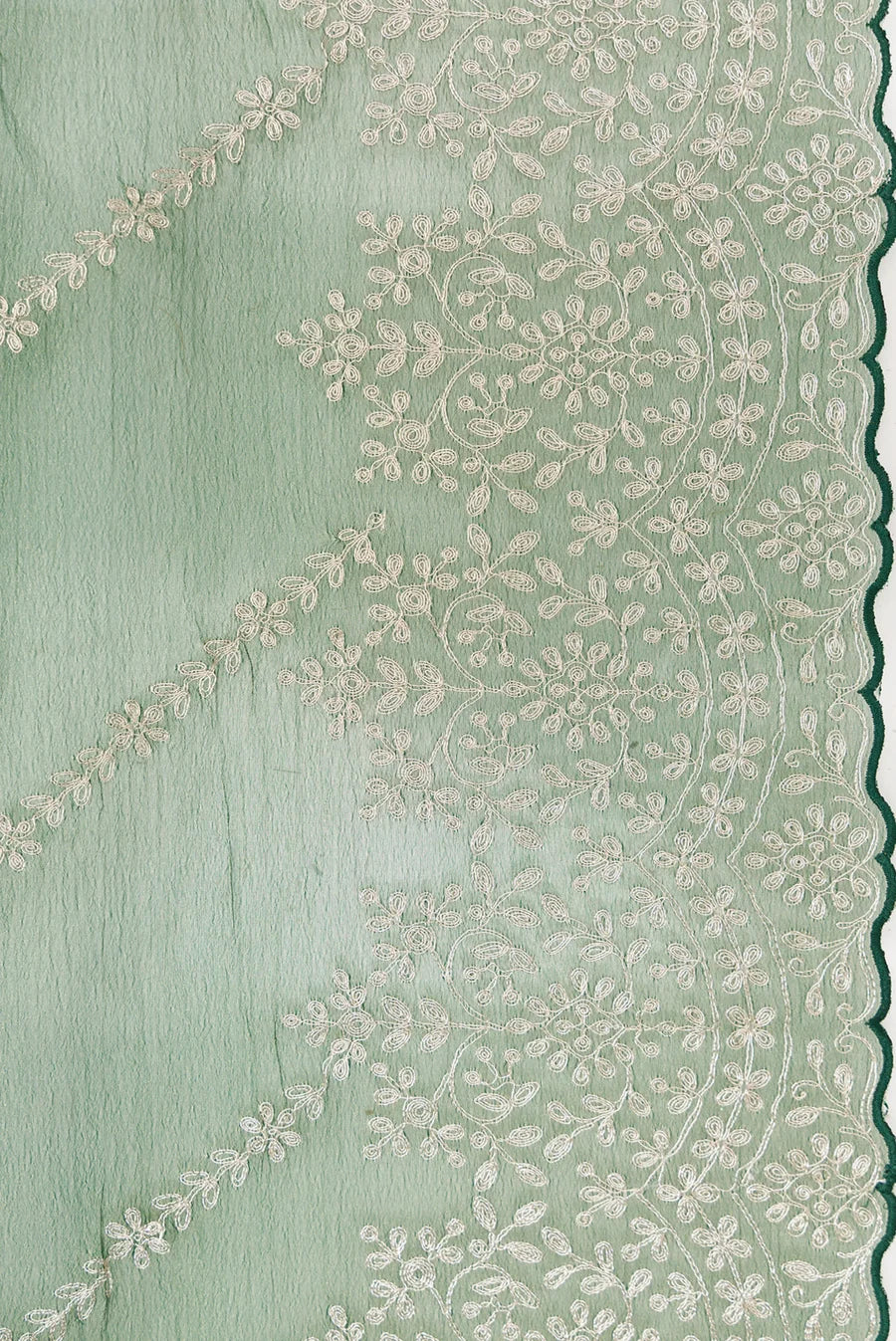 Green Organza Silk Saree with Embroidery on the body and Embroidery Border. Includes unstitched blouse.